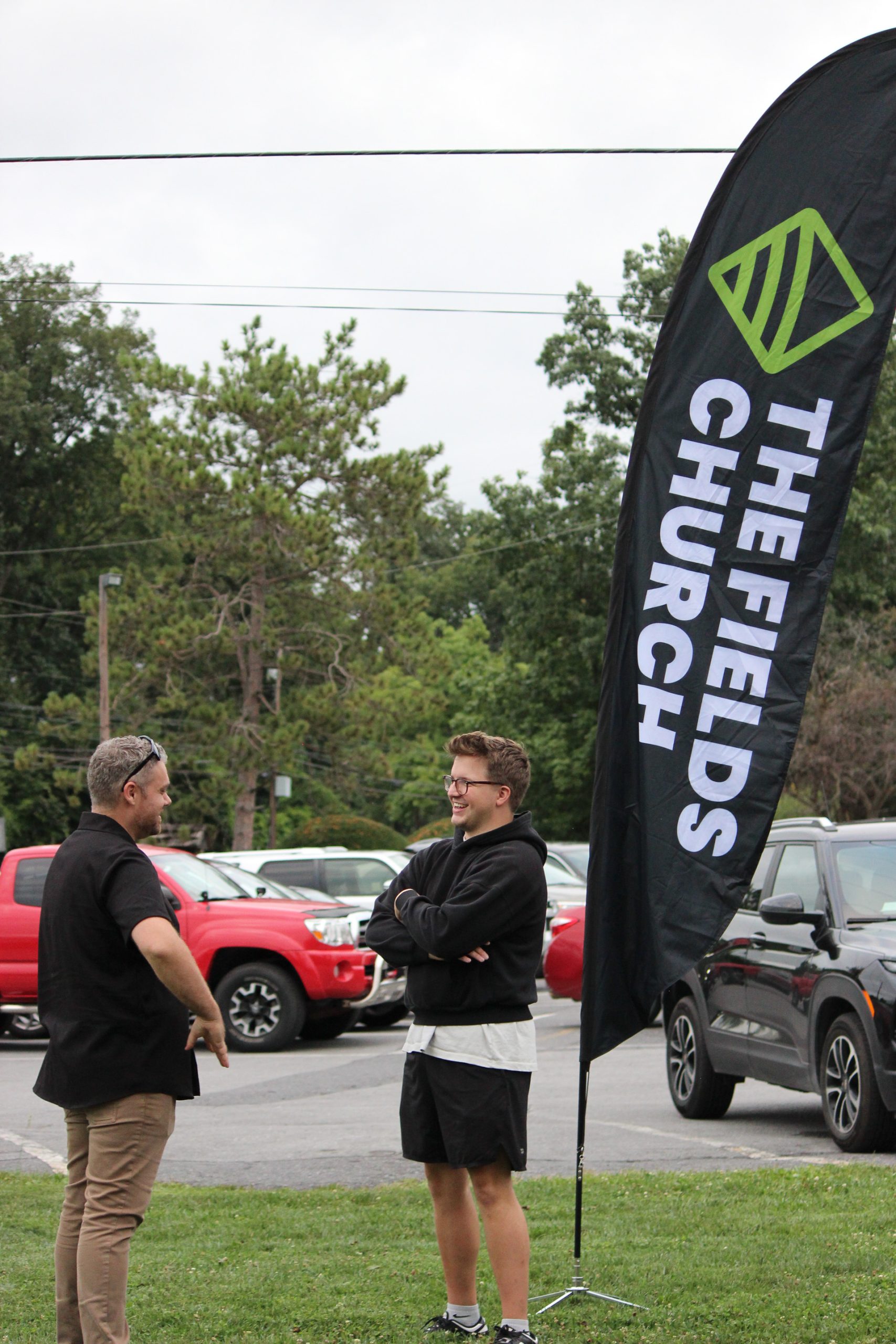 A group of people talking at The Fields Church at State College in Pennsylvania.