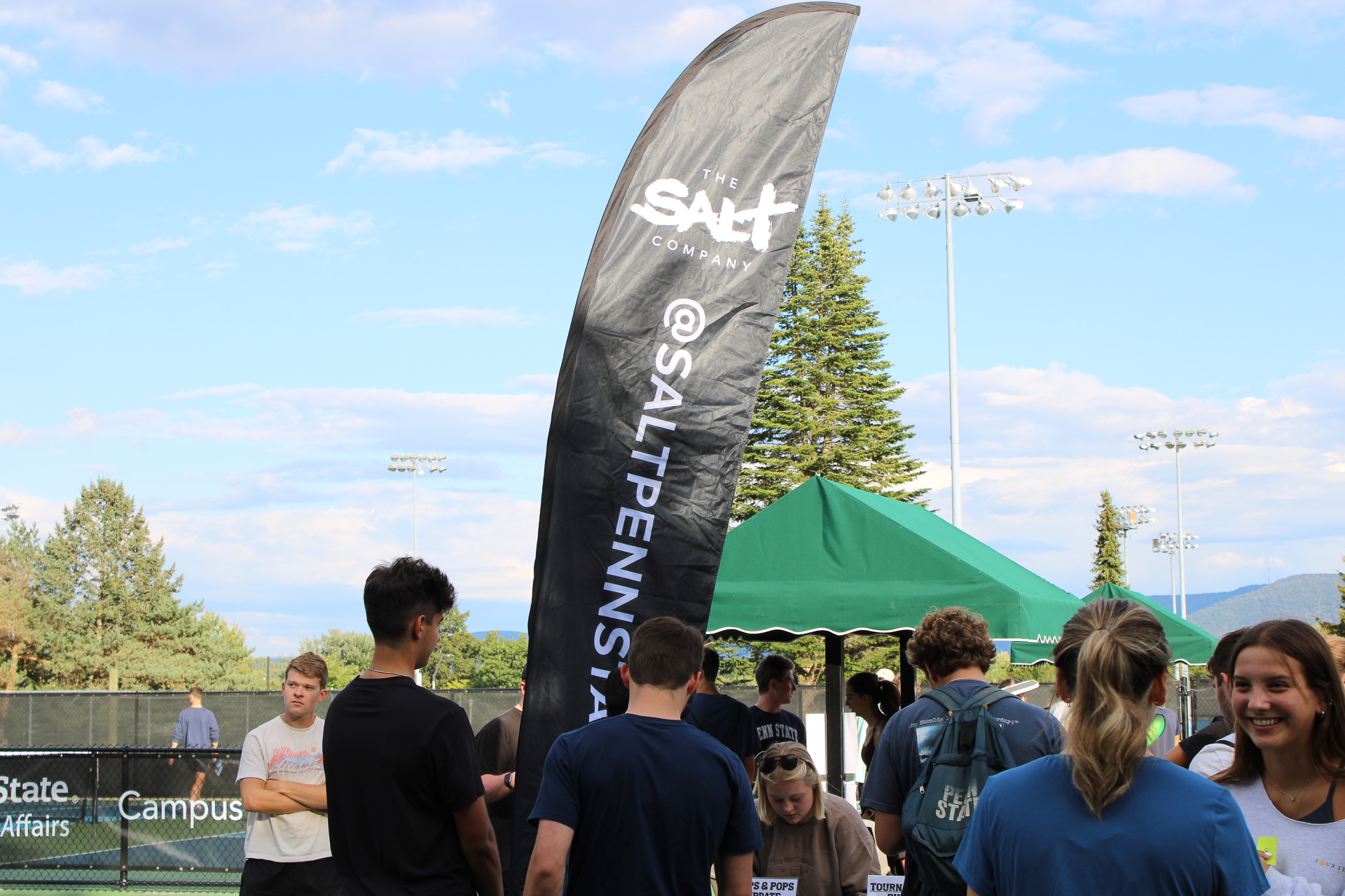 Penn State College Ministry Playing football at outdoor event at Salt Penn State in Pennsylvania.